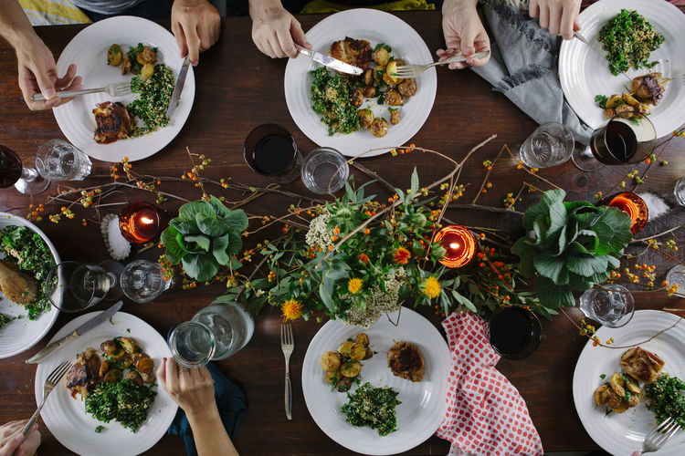 High angle view of people eating dinner