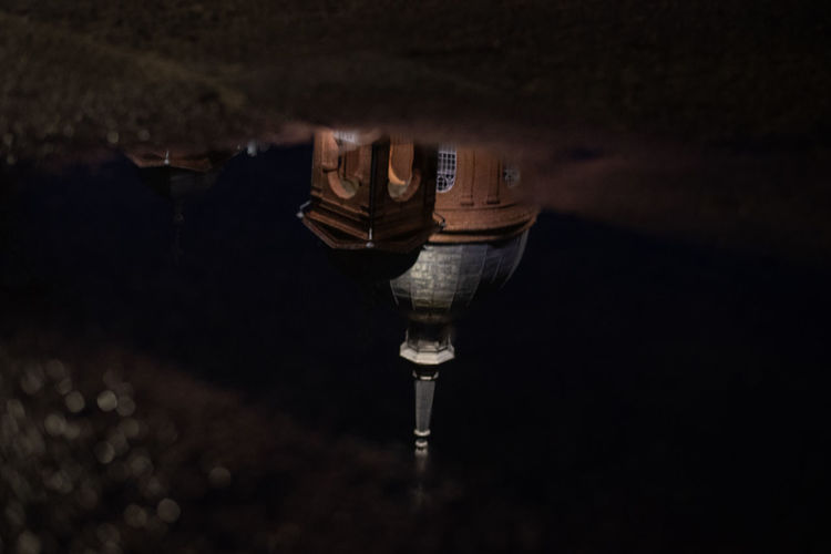 High angle view of light bulbs in water at night