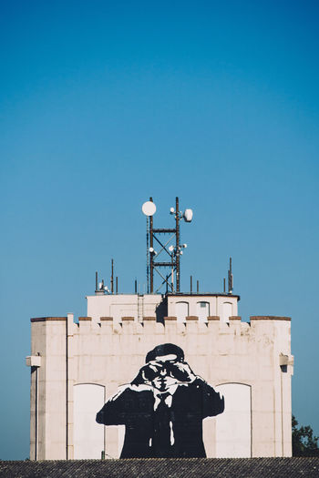 Silhouette of woman against clear blue sky