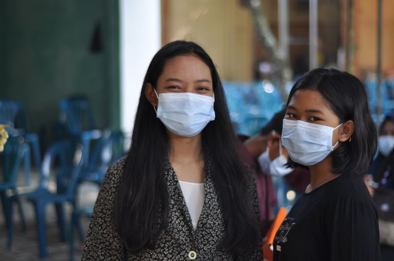Young woman wearing health mask