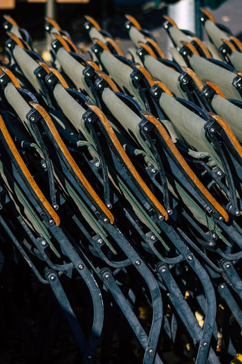 Close-up of chairs arranged indoors