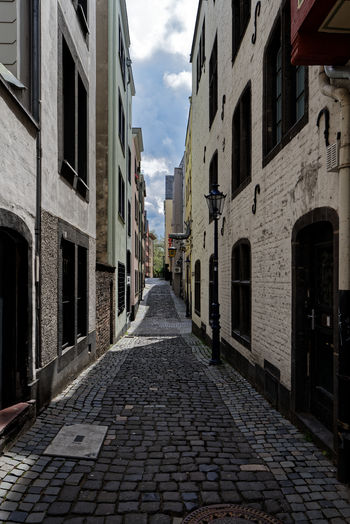 Narrow alley amidst buildings in city