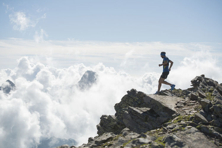 Italy, alagna, trail runner on the move near monte rosa mountain massif