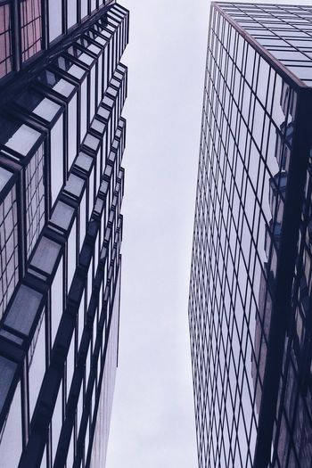 Low angle view of skyscraper against sky
