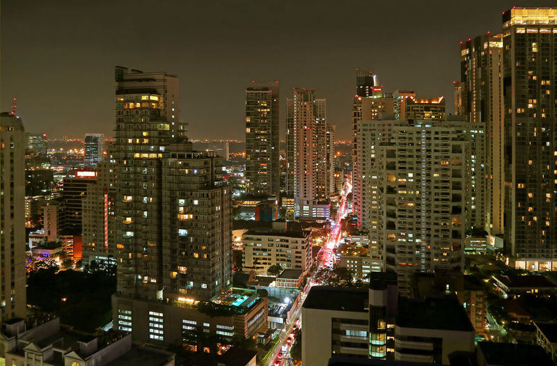 Stunning city view with groups of skyscrapers at night