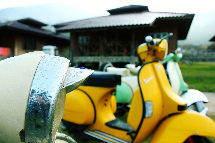 Close-up of yellow motorcycle
