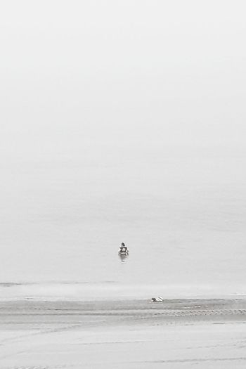 Man venturing into sea alone