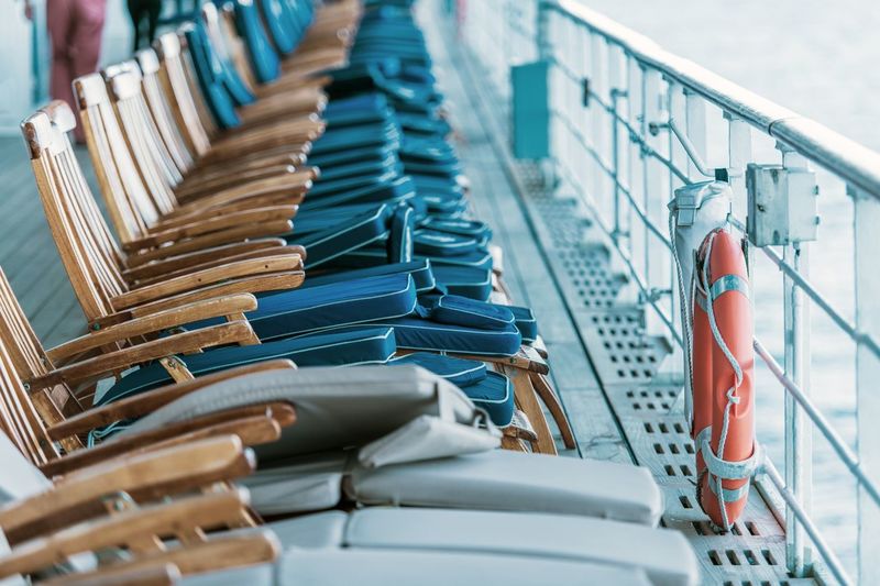 High angle view of chairs in row on ship