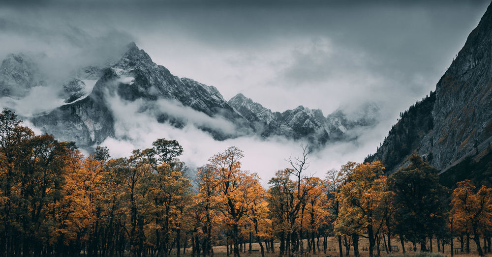 Scenic view of snowcapped mountains against sky during autumn