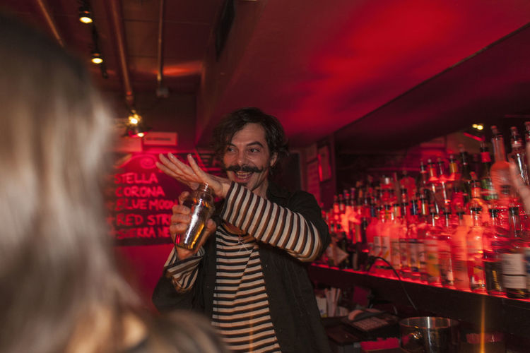 Bartender serving drinks at a nightclub