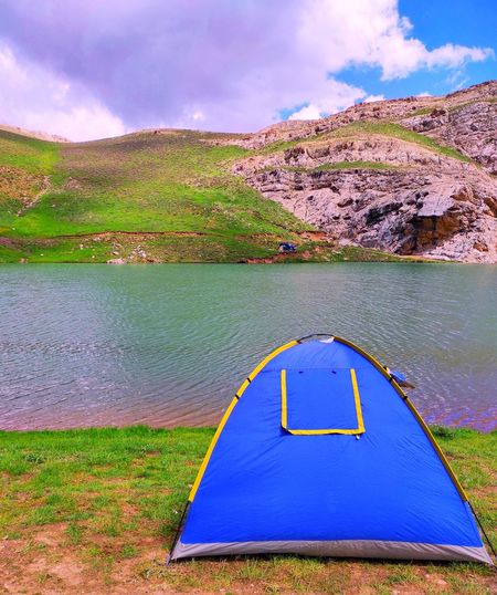 Travel tent on a beautiful plain next to a wonderful lake