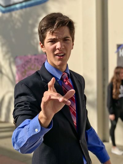 Portrait of young man gesturing
