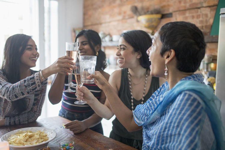 Young women making a toast at a party
