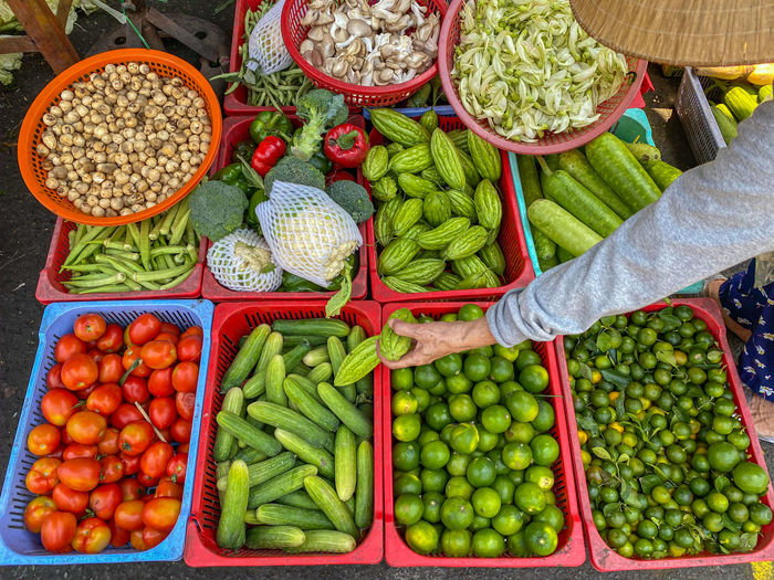 People buying vegetable at vietnam outdoor market