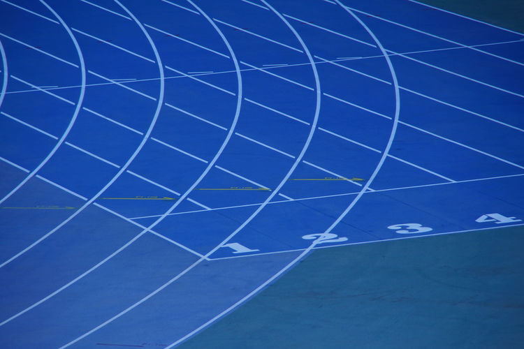High angle view of running tracks on field