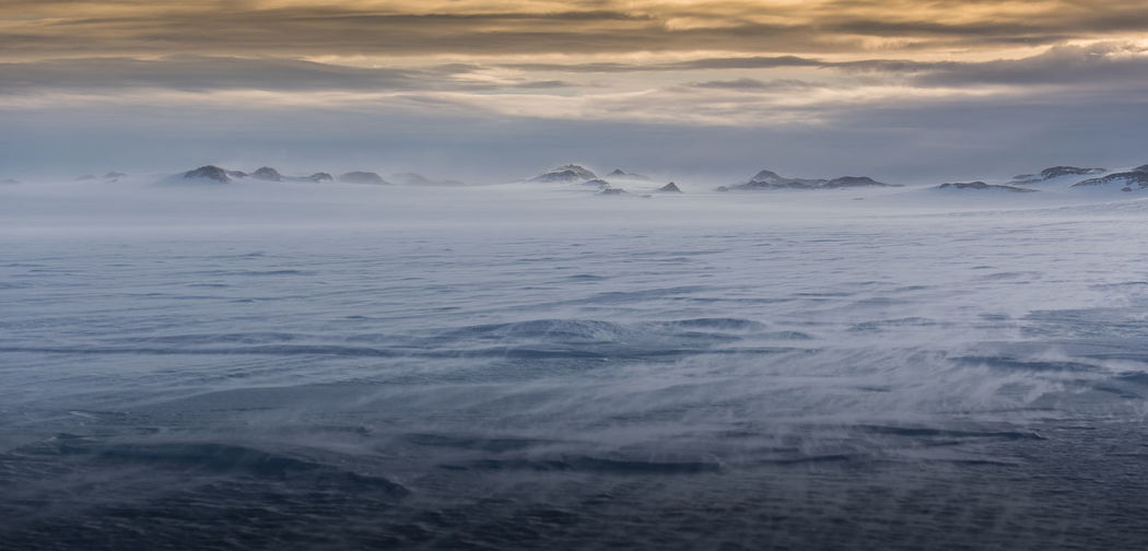Scenic view of sea against sky during winter