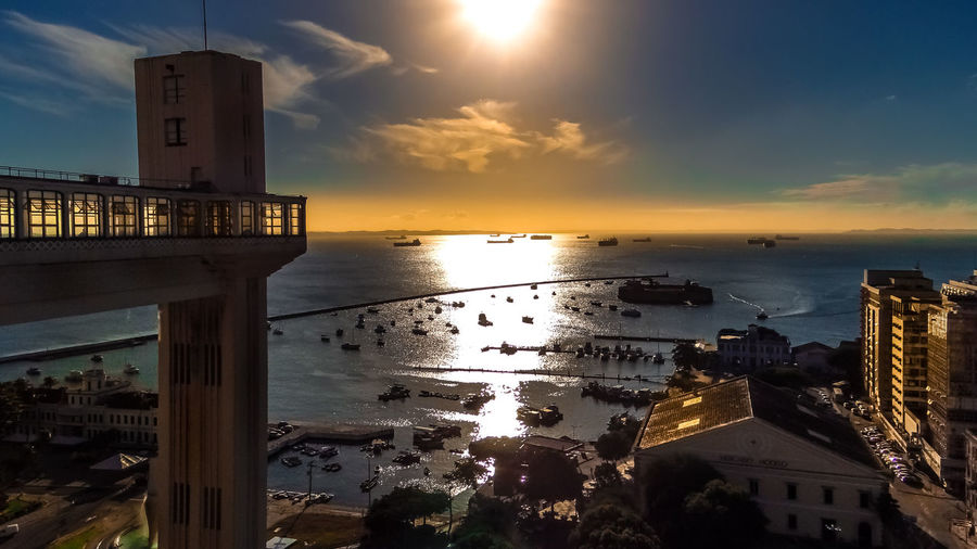 City at waterfront during sunset