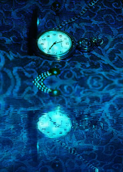 Reflection of clock on water