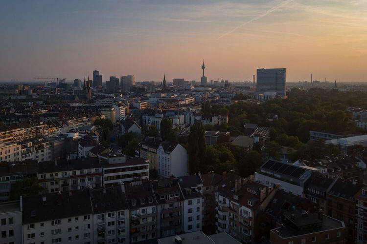 High angle view of buildings in dusseldorf, germany against sky during sunset