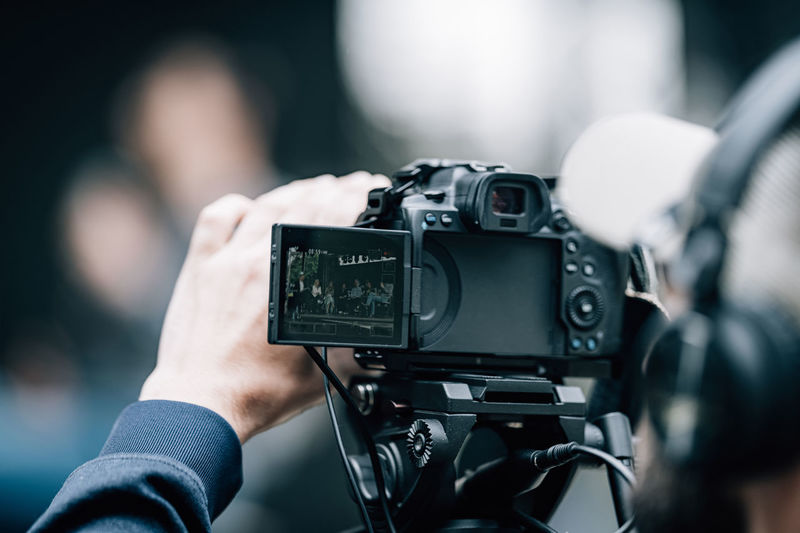 Camera at a panel discussion conference