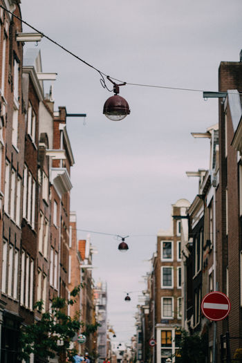 Hanging street lamps on amsterdam streets, holland, netherlands.