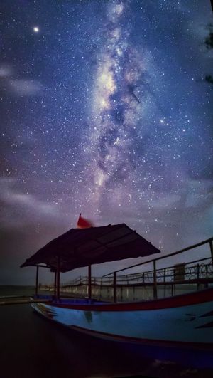 Low angle view of dramatic sky at night