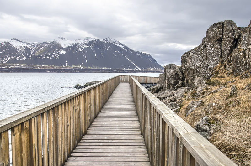 Wooden walkbridge along a fjord in borgarnes,, iceland