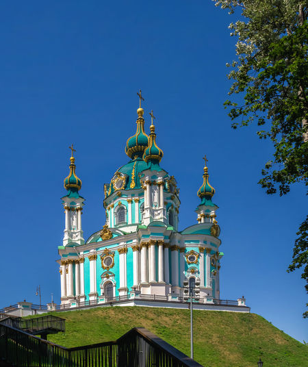 The st. andrew church and the andriyivskyy descent in kyiv, ukraine, on a sunny summer day