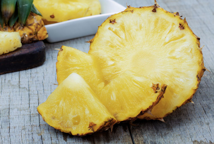 Close-up of pineapple slices on table