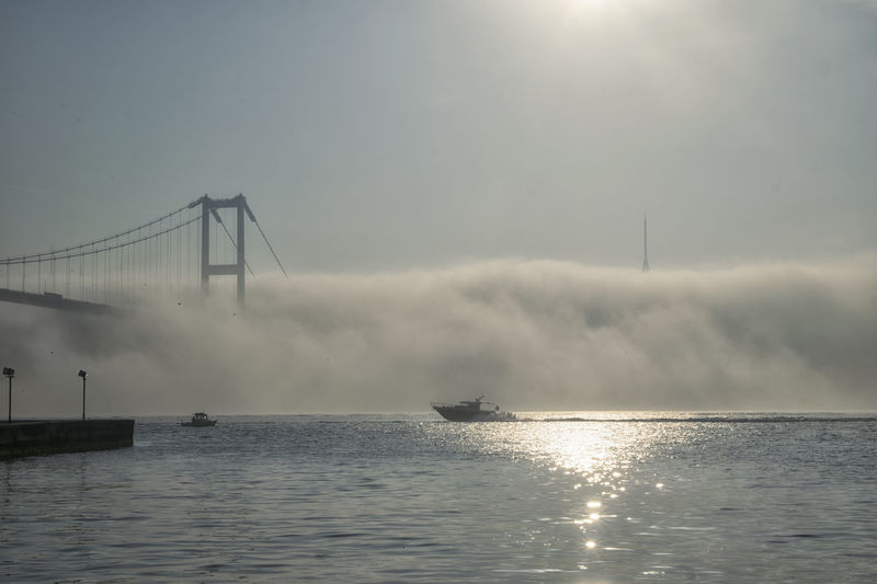 Speed boat and 15 july martyrs in foggy morning istanbul turkey 