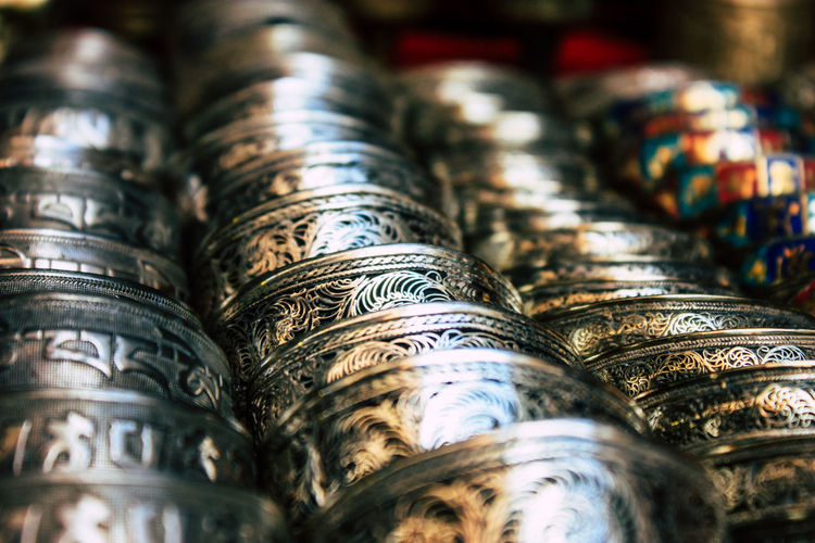 Close-up of metallic bowls for sale in market