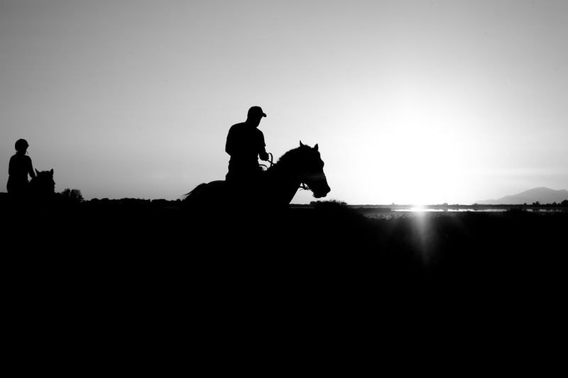 Silhouette man against sky