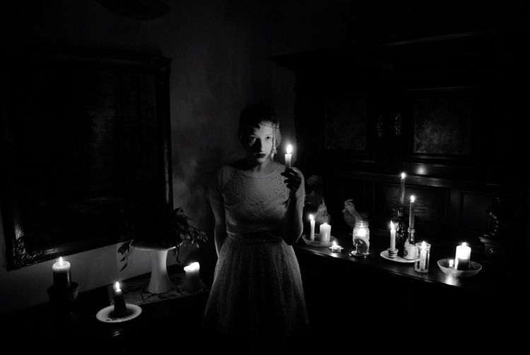View of woman in dark room