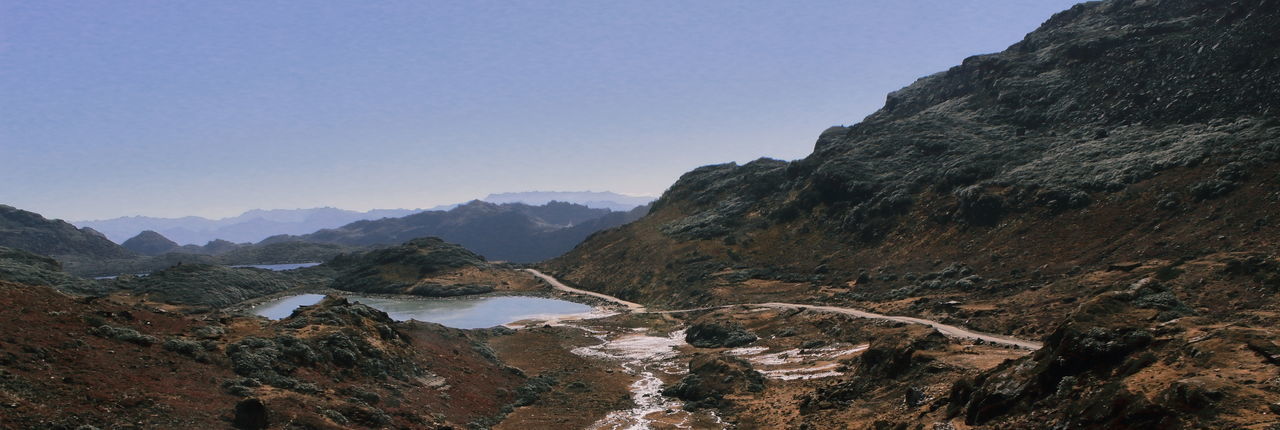 Alpine tundra landscape and lakes with mountain road near bum la pass in tawang, north east india