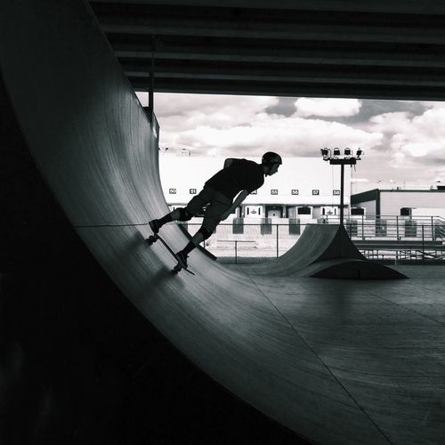 Young man skateboarding in skatepark