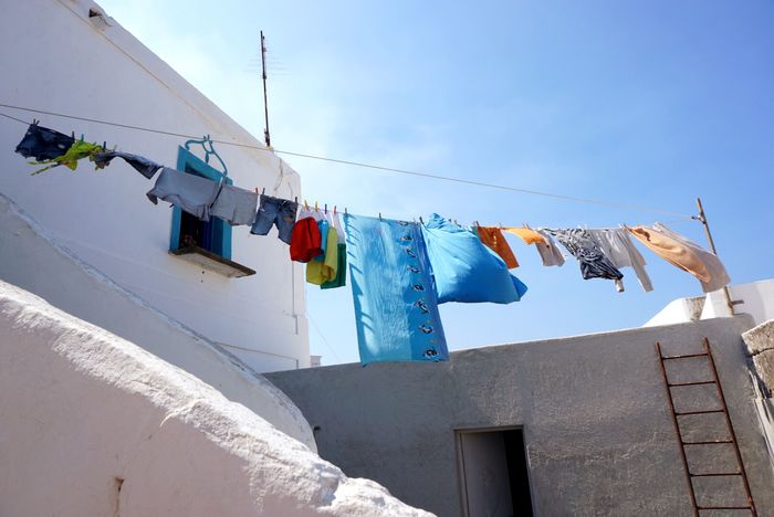 Low angle view of clothing on clothesline at building
