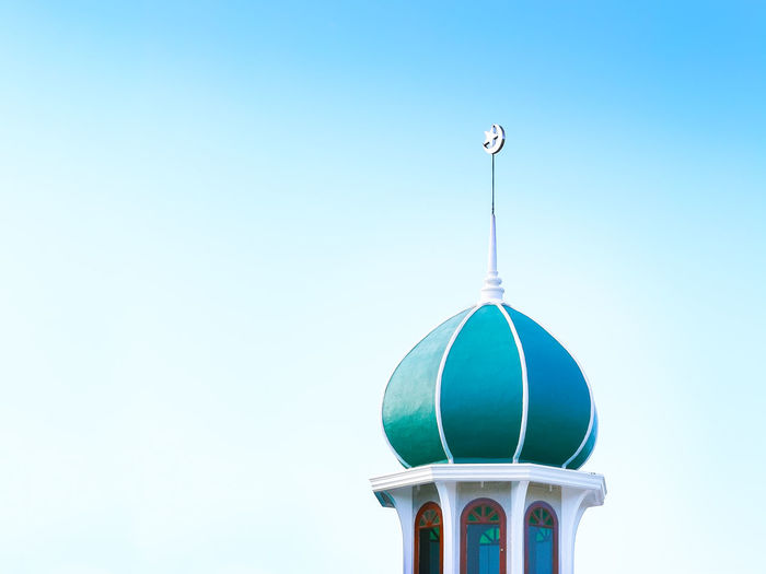 Low angle view of mosque against clear sky