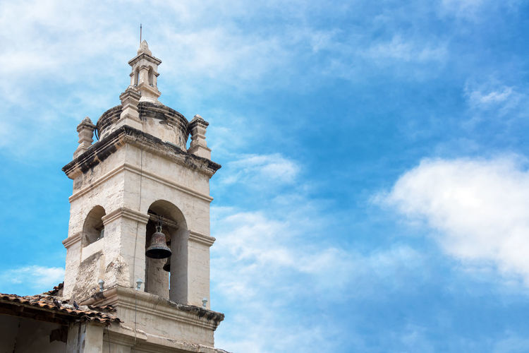 Low angle view of bell tower against sky at ayacucho region
