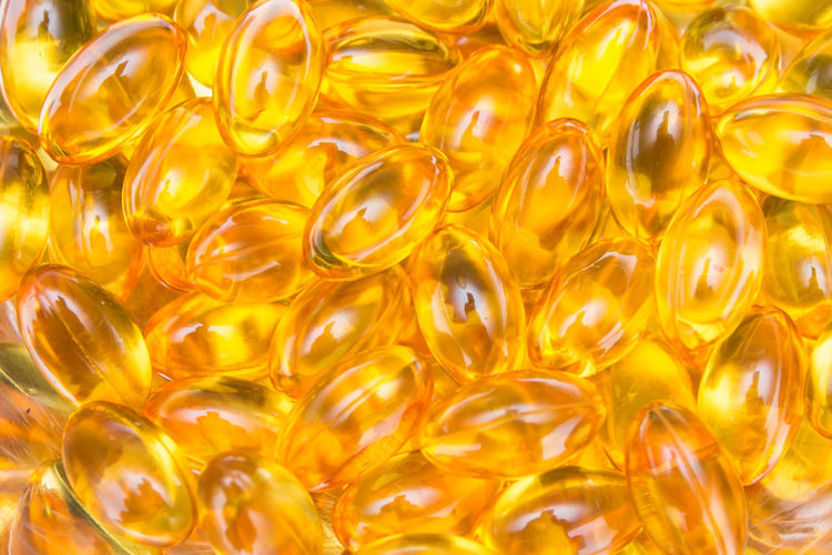 Full frame shot of yellow capsules