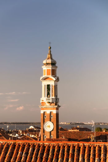 Tower amidst buildings against sky in city