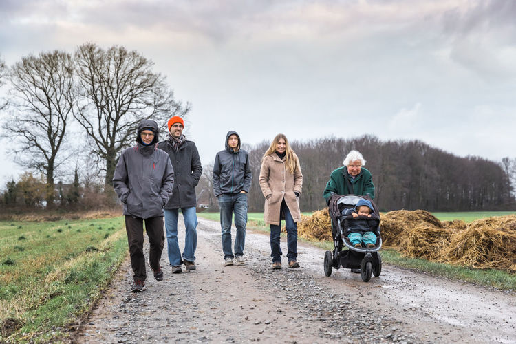 Family walking on road