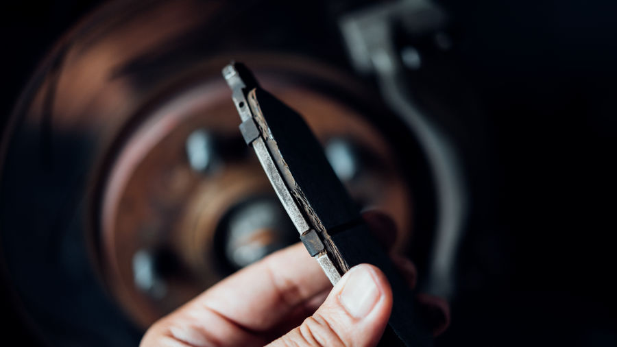 Cropped hand of person holding metal equipment