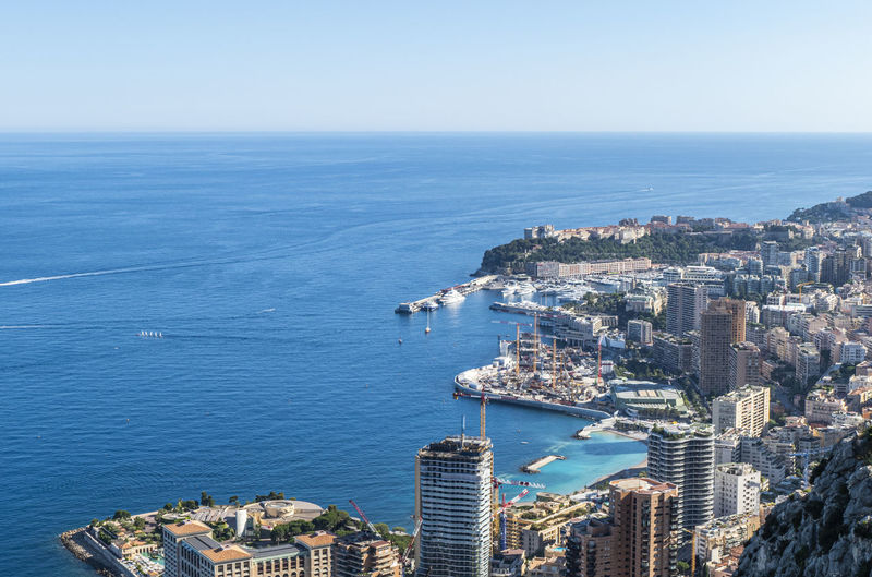 Aerial view of monaco with skyscrapers and blue sea