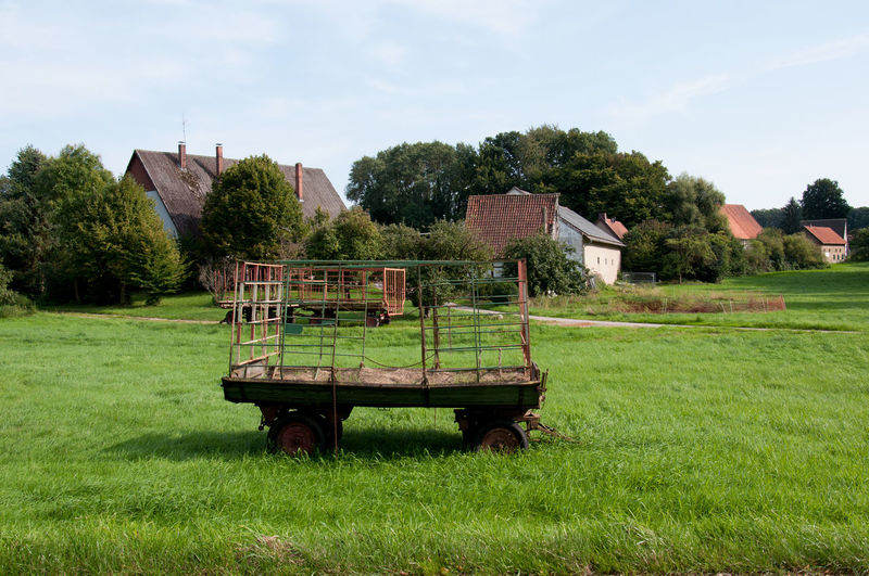 Built structure on agricultural field against sky