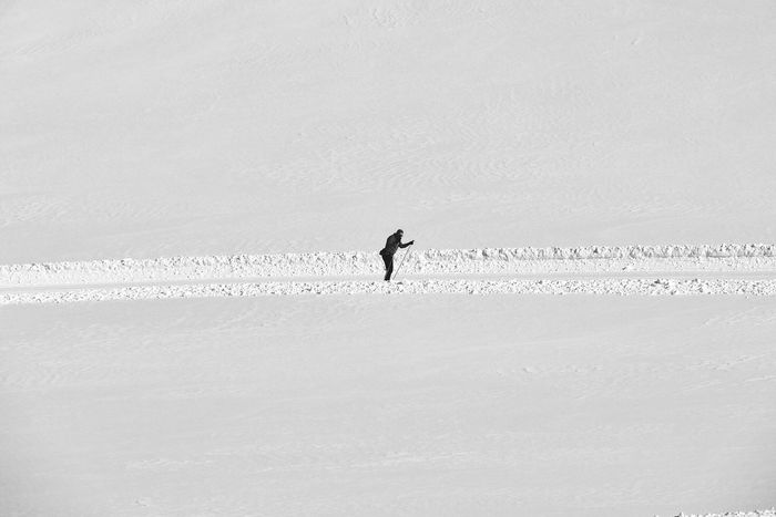 Person skiing in snow covered landscape