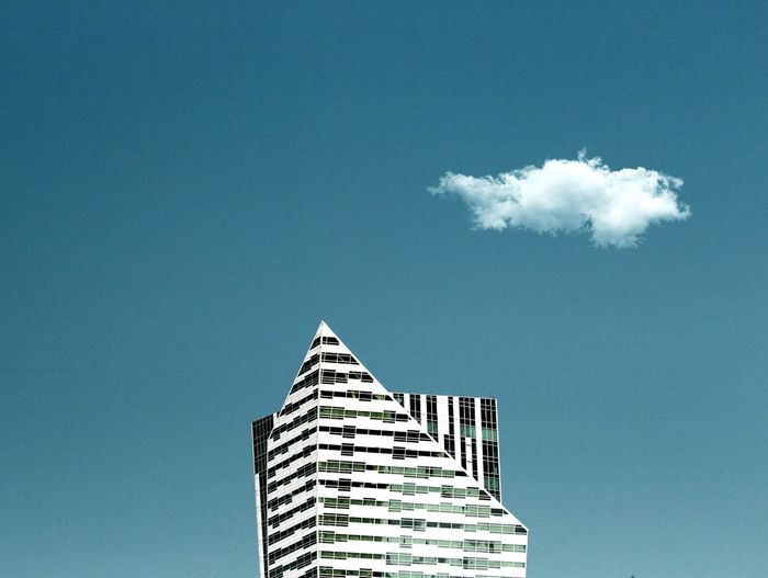 Close-up of building against blue sky