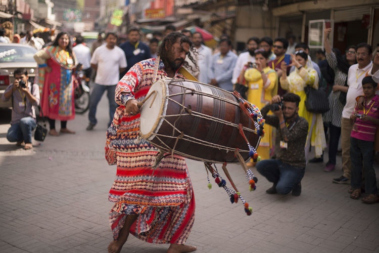 Traditional dhole beater performing in the famous food street of gawalmandi with cultural outfit. 