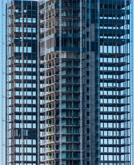 Low angle view of modern  building  under construction in city
