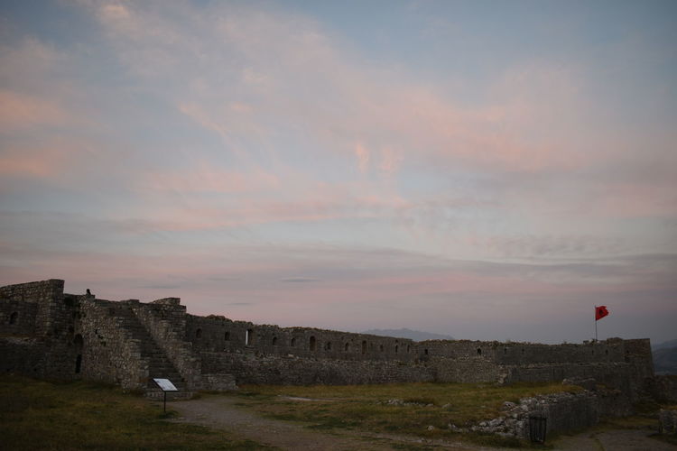 Old ruin building against sky during sunset