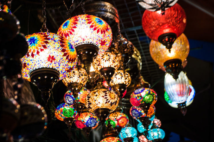 Low angle view of multi colored decorations hanging at market stall